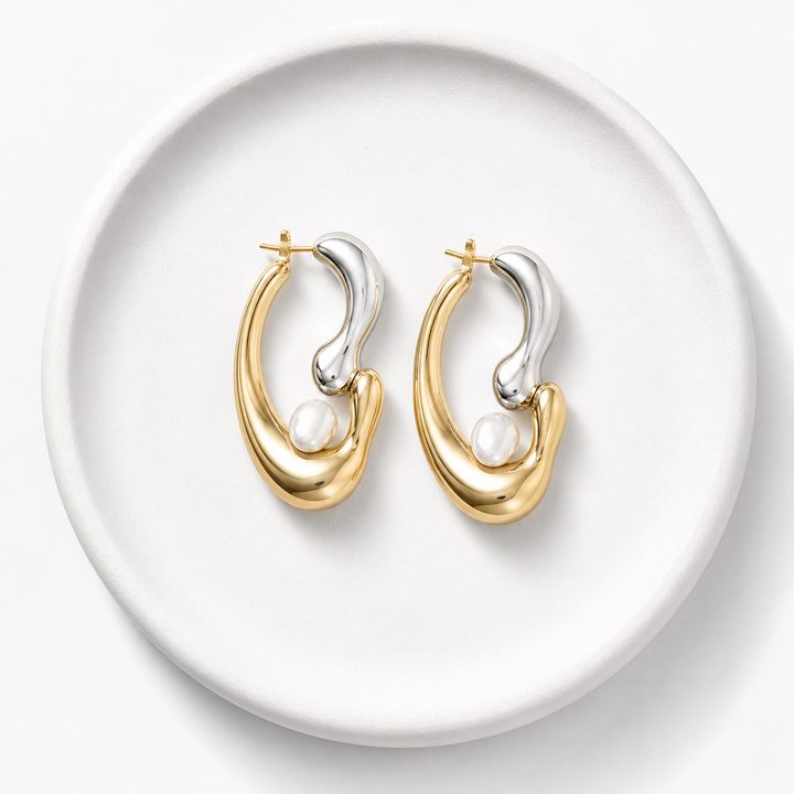 Rare Matters earrings displayed on a white ceramic plate