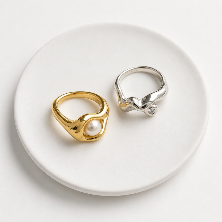 Rare Matters rings displayed on a white ceramic plate